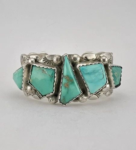 VTG E & C FIERRO NAVAJO STERLING SILVER FOX TURQUOISE STAMPED CUFF BRACELET: Vtg E & C Fierro Navajo Sterling Silver Fox Turquoise Stamped Cuff Bracelet Cuff is A Tad Over 5" tip to Tip and has a 1" Wide Adjustable Gap Cuff Is Over 1" Wide In the Center Weight is 66.7 Grams on