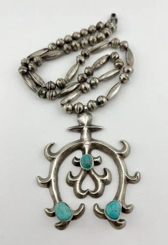 OLD NAVAJO SANDCAST STERLING SILVER TURQUOISE BENCH BEAD NAJA NECKLACE PENDANT: OLD Navajo Sandcast Sterling Silver Turquoise Bench Bead NAJA Necklace Pendant MEASUREMENTS: Necklace measures 23.5" Tip To Tip Naja Pendant is Just Over 3 1/4" Tall With Bail by 2 5/8" Wide Bench Bea
