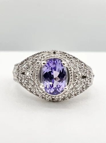 DESIGNER FINE 14K WHITE GOLD 1.00CT NATURAL TANZANITE & .25CT PAVE DIAMOND RING: DESIGNER FINE 14K WHITE GOLD 1.00CT NATURAL TANZANITE & .25CT PAVE DIAMOND RING Designer Fine 14k White Gold 1.00ct Natural Tanzanite & .25ct Pave Diamond Ring Size: 7 - Can Be Resized Weight is 6.5 G