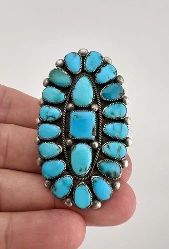 HUGE VINTAGE ONDELACY WEEBOTHEE ZUNI LONE MOUNTAIN TURQUOISE CLUSTER RING 2.25": HUGE Vintage Ondelacy Weebothee Zuni Lone Mountain Turquoise Cluster Ring 2.25" Ring Size: 9.5 - Can Be re Sized Weight is 17.5 Grams on my scale Metal: Sterling Silver Ring is 2 1/4" Tall In the Cent