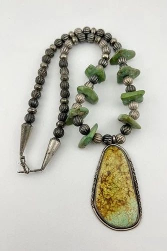 VTG NAVAJO STERLING SILVER ROYSTON TURQUOISE HOGAN FLUTED BENCH BEAD NECKLACE: Vtg Navajo Sterling Silver Royston Turquoise HOGAN Fluted Bench Bead Necklace MEASUREMENTS: Necklace measures 25" Tip To Tip Pendant Size: is 3" Tall by 1 5/8"Wide Stamped HOGAN Fluted Bench Bead Pear