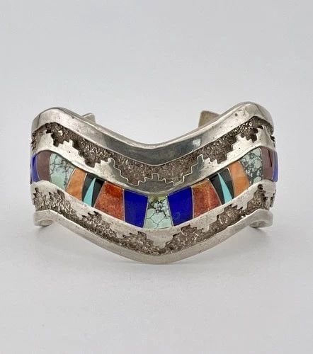CALVIN BEGAY NAVAJO STERLING FLUSH MULTI GEMS OVERLAY WAVE CUFF BRACELET 74.8G: Calvin Begay Navajo Sterling Flush Multi Gems Overlay Wave Cuff Bracelet 74.8g Cuff is Around 5 1/4" tip to Tip and has a 1 1/4" Wide Gap Cuff Is 1 1/8" Wide In the Center Weight is 74.8 Grams on my s