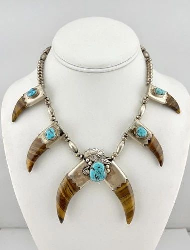 RUNNING BEAR NAVAJO STERLING SILVER TURQUOISE & TIGER'S EYE CLAW COLLAR NECKLACE: Running Bear Navajo Sterling Silver Turquoise & Tiger's Eye Claw Collar Necklace MEASUREMENTS: Necklace measures 19.75" Tip To Tip Adjustable Down In Size Pendant is 2 3/4" Tall by 2 3/4" Wide Saucer 