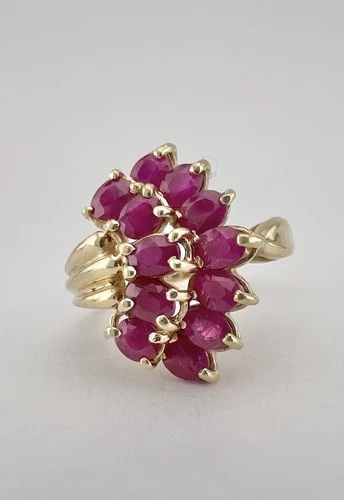 DESIGNER 10K YELLOW GOLD NATURAL MARQUIESE CUT RUBY CLUSTER RING: Designer 10k Yellow Gold Natural Marquiese Cut Ruby Cluster Ring Ring Size: 8.5 - Can Be Resized Metal: 10k Yellow Gold - Tested & Hallmarked Weight is 5.1 Grams on my scale Ring is 7/8" (20mm) Wide I