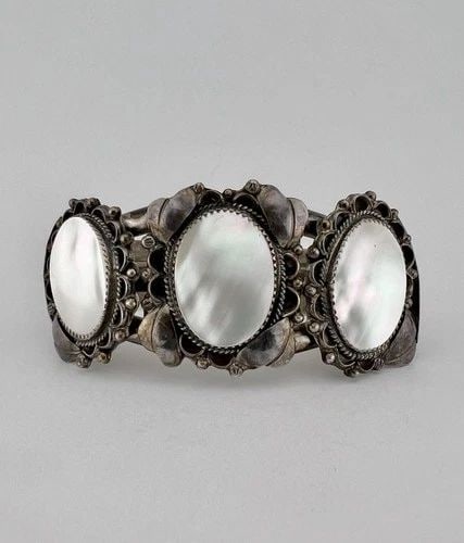 HUGE VINTAGE NAVAJO STERLING SILVER MOTHER OF PEARL STAMPED CUFF BRACELET 72.3G: HUGE Vintage Navajo Sterling Silver Mother of Pearl Stamped Cuff Bracelet 72.3g Cuff is A Tad over 5" tip to Tip and has a 1 1/8" Wide Slightly Adjustable Gap Cuff Is 1 1/2" Wide In The Center Total W