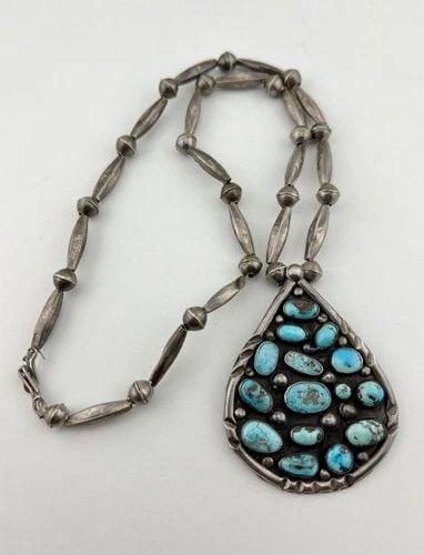 VTG NAVAJO STERLING SILVER BISBEE TURQUOISE BENCH BEAD TEARDROP NECKLACE PENDANT: Vtg Navajo Sterling Silver Bisbee Turquoise Bench Bead Teardrop Necklace Pendant MEASUREMENTS: Necklace measures 23" Tip To Tip Pendant is 2 3/4" Tall by 2 1/8" Wide Saucer Bench Bead Pearls Are 8mm W