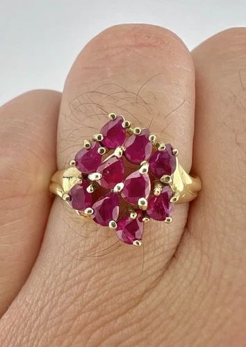 DESIGNER 10K YELLOW GOLD NATURAL PEAR SHAPED RUBY CLUSTER RING: Designer 10k Yellow Gold Natural Pear Shaped Ruby Cluster Ring Ring Size: 10 - Can Be Resized Metal: 10k Yellow Gold - Tested & Hallmarked Weight is 3.9 Grams on my scale Ring is 15.5mm Wide In The Ce