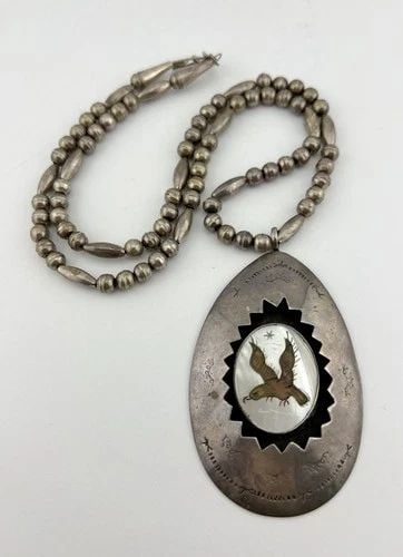 OLD ZUNI STERLING SILVER FLUSH GEM'S EAGLE SHADOWBOX BENCH BEAD NECKLACE PENDANT: OLD Zuni Sterling Silver Flush Gem's Eagle Shadowbox Bench Bead Necklace Pendant MEASUREMENTS: Necklace measures 24.5" Tip To Tip Pendant is 3 1/4" Tall by About 2" Wide Bench Bead Pearls Are 6mm Wide