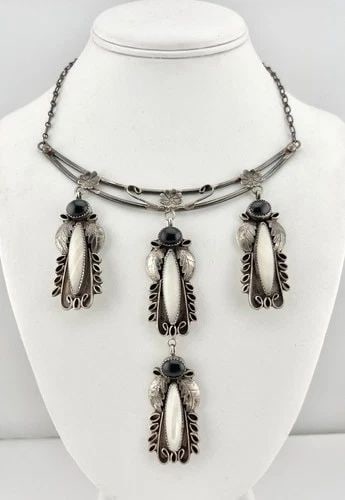VTG NAVAJO STERLING SILVER MOTHER OF PEARL & ONYX STAMPED DANGLE COLLAR NECKLACE: Vtg Navajo Sterling Silver Mother of Pearl & Onyx Stamped Dangle Collar Necklace MEASUREMENTS: Necklace measures 16" Tip To Tip Center Dangle Pendant is 4 3/4" Tall With Dangle by Just Under 1" Wide W