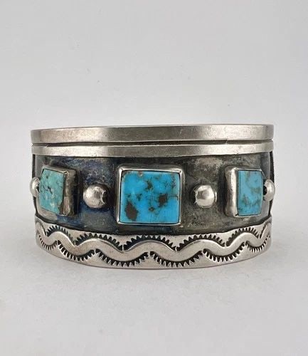VINTAGE NAVAJO STERLING SILVER BLUE GERM TURQUOISE STAMPED CUFF BRACELET 63.3G: VINTAGE NAVAJO STERLING SILVER BLUE GERM TURQUOISE STAMPED CUFF BRACELET 63.3G Vintage Navajo Sterling Silver Blue Germ Turquoise Stamped Cuff Bracelet 63.3g Cuff is 5 3/8" tip to Tip and has a 1 1/2"
