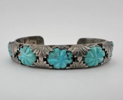 VINTAGE LOYOLITA TSATTIE ZUNI CARVED TURQUOISE STERLING SILVER CUFF BRACELET: VINTAGE LOYOLITA TSATTIE ZUNI CARVED TURQUOISE STERLING SILVER CUFF BRACELET Vintage Loyolita Tsattie Zuni Carved Turquoise Sterling Silver Cuff Bracelet Cuff is 5 1/4" tip to Tip and has a 1" Wide - 