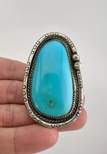 HUGE VTG NAVAJO STERLING SILVER HIGH GRADE ROYSTON TURQUOISE STAMPED RING 30.8G: HUGE Vtg Navajo Sterling Silver High Grade Royston Turquoise Stamped Ring 30.8g Ring Size: 12 - Can Be Re Sized Weight is 30.8 Grams on my scale Metal: Sterling Silver Ring is 2 3/8" Tall In the Cente