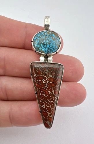 VTG NAVAJO STERLING SILVER LONE MOUNTAIN TURQUOISE & FOSSILIZED DINOSAUR PENDANT: Vtg Navajo Sterling Silver Lone Mountain Turquoise & Fossilized Dinosaur Pendant Size: 2 1/2" Tall With Bail & 3/4" Wide Weight is 19.2 Grams on my scale Metal: Sterling Silver Amazing High Grade Webb