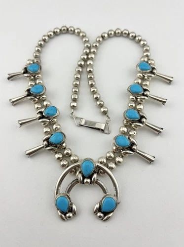 VTG NAVAJO STERLING SILVER BLUE TURQUOISE SQUASH BLOSSOM NECKLACE 21.25" - 58.6G: VTG NAVAJO STERLING SILVER BLUE TURQUOISE SQUASH BLOSSOM NECKLACE 21.25" - 58.6G Vtg Navajo Sterling Silver Blue Turquoise Squash Blossom Necklace 21.25" - 58.6g This Amazing necklace features huge sp