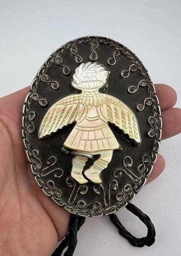 100G VINTAGE NAVAJO STERLING SILVER MOTHER OF PEARL WINGED KACHINA BOLO TIE 4": 100G VINTAGE NAVAJO STERLING SILVER MOTHER OF PEARL WINGED KACHINA BOLO TIE 4" BIG Vtg Navajo Sterling Silver Carved Mother Of Pearl Winged Kachina Bolo Tie 4" Size: 4" Tall By 3 1/8" Wide Metal: Ster