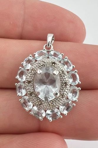 DESIGNER 10K WHITE GOLD LIGHT BLUE AQUAMARINE & DIAMOND HALO CLUSTER PENDANT: DESIGNER 10K WHITE GOLD LIGHT BLUE AQUAMARINE & DIAMOND HALO CLUSTER PENDANT Designer 10K White Gold Light Blue Aquamarine & Diamond Halo Cluster Pendant Size: 1 1/8" Tall With Bail By 3/4" Wide & 1/2