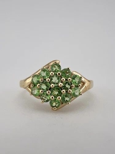DESIGNER 14K YELLOW GOLD NATURAL GREEN TSAVORITE CLUSTER RING: DESIGNER 14K YELLOW GOLD NATURAL GREEN TSAVORITE CLUSTER RING Designer 14k Yellow Gold Natural Green Tsavorite Cluster Ring Ring Size: 9.25 - Can Be Resized Metal: 14k Yellow Gold - Tested & Hallmarke