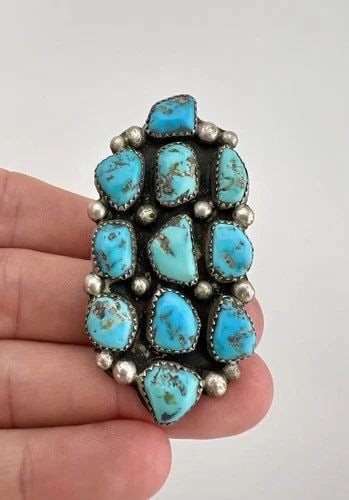 HUGE VTG ZUNI STERLING SILVER NEVADA TURQUOISE CLUSTER WOMEN'S RING 2 3/8": HUGE Vtg Zuni Sterling Silver Nevada Turquoise Cluster Women's Ring 2 3/8" Ring Size: 7 Weight is 18.9 Grams on my scale Metal: Sterling Silver Ring is 2 3/8" Tall In the Center by 1 1/4" Wide Amazing