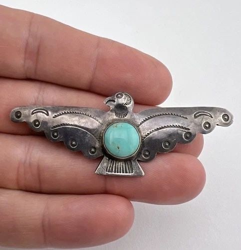OLD UITA-36 NAVAJO STERLING SILVER TURQUOISE STAMPED THUNDERBIRD PIN BROOCH 2.5": Old UITA-36 Navajo Sterling Silver Turquoise Stamped Thunderbird Pin Brooch 2.5" Size: 2 1/2" Wide By 1" Tall Metal: Sterling Silver / Coin Silver Weight is 6.8 Grams on my scale In Great Antique Cond