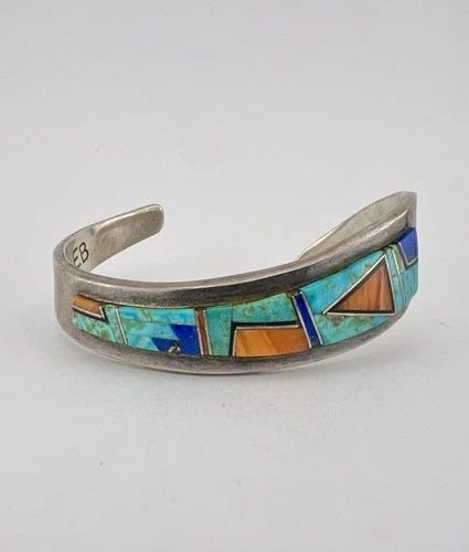 VINTAGE EUGENE BELONE NAVAJO STERLING SILVER MULTI GEMSTONE CUFF BRACELET: VINTAGE EUGENE BELONE NAVAJO STERLING SILVER MULTI GEMSTONE CUFF BRACELET Vintage Eugene Belone Navajo Sterling Silver Multi Gemstone Cuff Bracelet Cuff Size is 5 1/4" tip to Tip and has an Around 1 1