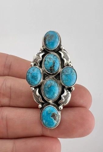 GERALDINE JAMES NAVAJO STERLING SILVER KINGMAN TURQUOISE STAMPED RING 2 1/8": Geraldine James Navajo Sterling Silver Kingman Turquoise Stamped Ring 2 1/8" Ring Size: 6.75 - Can Be Resized Weight is 17.6 Grams on my scale Metal: Sterling Silver Ring is 2 1/8" Tall In the Center 