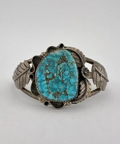 VTG NAVAJO NATURAL RED MOUNTAIN TURQUOISE STERLING SILVER STAMPED CUFF BRACELET: Vtg Navajo Natural Red Mountain Turquoise Sterling Silver Stamped Cuff Bracelet Cuff is 5" tip to Tip and has an 1 1/4" Wide Adjustable Gap Cuff Is 1 3/8" Wide In the Center Weight is 27.2 Grams on my