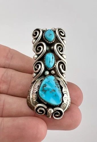 HUGE 2.25" VTG NAVAJO STERLING SILVER SLEEPING BEAUTY TURQUOISE STAMPED RING 21G: HUGE 2.25" Vtg Navajo Sterling Silver Sleeping Beauty Turquoise Stamped Ring 21g Ring Size: 6.75- Can Be Resized Weight is 21.0 Grams on my scale Test Positive For Sterling Silver Ring is 2 1/4" Tall 