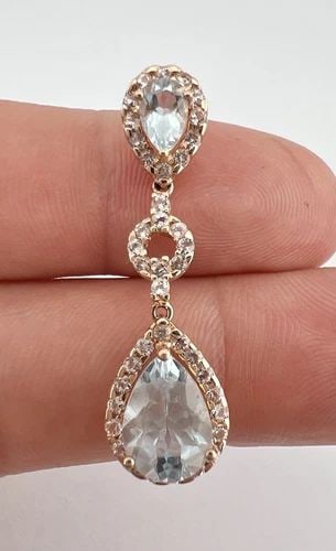 DESIGNER 10K ROSE GOLD BLUE & WHITE TOPAZ HALO DANGLE PENDANT 1.5": DESIGNER 10K ROSE GOLD BLUE & WHITE TOPAZ HALO DANGLE PENDANT 1.5" Designer 10k Rose Gold Blue & White Topaz Halo Dangle Pendant 1.5" Size: 1 1/2" Tall By Just Under 1/2" Wide At The Base Metal: 10k R