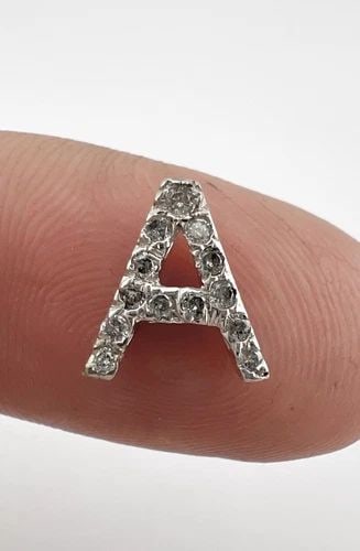 DESIGNER 14K WHITE GOLD LETTER "A" DIAMOND SLIDE CHARM PENDANT: DESIGNER 14K WHITE GOLD LETTER "A" DIAMOND SLIDE CHARM PENDANT Designer 14k White Gold Letter "A" Diamond Slide Charm Pendant Size: 3/8" (9mm) Tall by 3/8" (8.5mm) Wide Weight is 1.0 Grams on My Scale