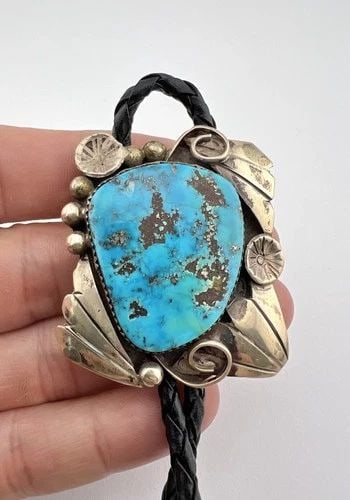 VINTAGE NAVAJO STERLING SILVER HIGH GRADE MORENCI TURQUOISE STAMPED BOLO TIE 2": VINTAGE NAVAJO STERLING SILVER HIGH GRADE MORENCI TURQUOISE STAMPED BOLO TIE 2" Vintage Navajo Sterling Silver High Grade Morenci Turquoise Stamped Bolo Tie 2" Size: 2" Tall by 1 5/8" Wide Weight is 3