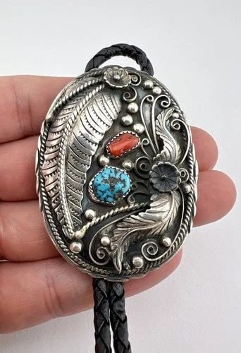 VTG NAVAJO STERLING SILVER NATURAL TURQUOISE & RED CORAL STAMPED BOLO TIE 2.5": VTG NAVAJO STERLING SILVER NATURAL TURQUOISE & RED CORAL STAMPED BOLO TIE 2.5" Vtg Navajo Sterling Silver Natural Turquoise & Red Coral Stamped Bolo Tie 2.5" Size: 2 1/2" Tall by 1 7/8" Wide Weight is