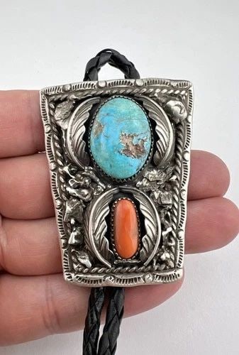 VTG NAVAJO STERLING SILVER KINGMAN TURQUOISE & RED CORAL STAMPED BOLO TIE 2.25": VTG NAVAJO STERLING SILVER KINGMAN TURQUOISE & RED CORAL STAMPED BOLO TIE 2.25" Vtg Navajo Sterling Silver Kingman Turquoise & Red Coral Stamped Bolo Tie 2.25" Size: 2 1/4" Tall by Just Under 2" Wide 