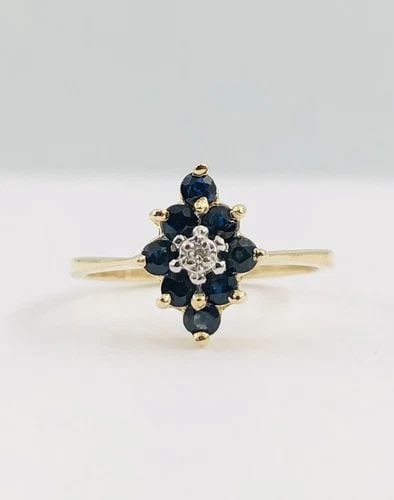DESIGNER 14K YELLOW GOLD NATURAL BLUE SAPPHIRE & DIAMOND ACCENT CLUSTER RING: DESIGNER 14K YELLOW GOLD NATURAL BLUE SAPPHIRE & DIAMOND ACCENT CLUSTER RING Designer 14K Yellow Gold Natural Blue Sapphire & Diamond Accent Cluster Ring Size: 5.25 - Can be Resized With Out Damage We