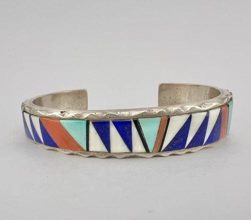 VTG RICK TOLINO NAVAJO STERLING SILVER MULTI GEMSTONE FLUSH INLAY CUFF BRACELET: VTG RICK TOLINO NAVAJO STERLING SILVER MULTI GEMSTONE FLUSH INLAY CUFF BRACELET Vtg Rick Tolino Navajo Sterling Silver Multi Gemstone Flush Inlay Cuff Bracelet Cuff is 5 1/8" tip to Tip and has a 1 1/