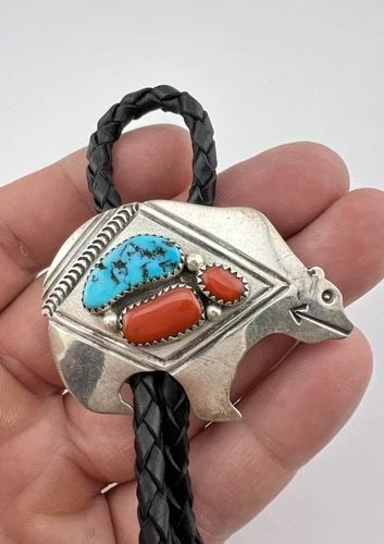 VTG PETER NELSON NAVAJO STERLING SILVER TURQUOISE & CORAL STAMPED BEAR BOLO TIE: VTG PETER NELSON NAVAJO STERLING SILVER TURQUOISE & CORAL STAMPED BEAR BOLO TIE Vtg Peter Nelson Navajo Sterling Silver Turquoise & Coral Stamped Bear Bolo Tie Size: 1 5/8" Tall by 2 1/8" Wide Weight 