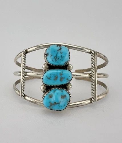 VTG NAVAJO STERLING SILVER SLEEPING BEAUTY TURQUOISE STAMPED CUFF BRACELET: VTG NAVAJO STERLING SILVER SLEEPING BEAUTY TURQUOISE STAMPED CUFF BRACELET Vtg Navajo Sterling Silver Sleeping Beauty Turquoise Stamped Cuff Bracelet Cuff is 5 1/8" tip to Tip and has a 1" Adjustable 