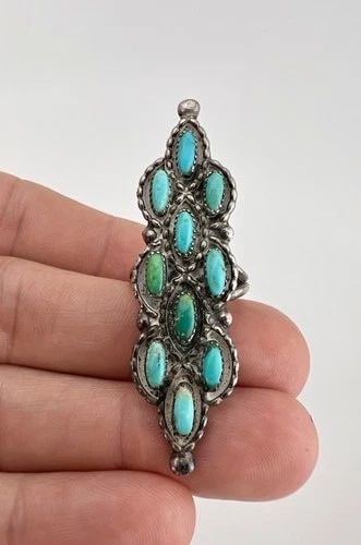 HUGE VTG NAVAJO STERLING SILVER NEEDLE POINT TURQUOISE CLUSTER LONG RING 2 1/8": HUGE Vtg Navajo Sterling Silver Needle Point Turquoise Cluster Long Ring 2 1/8" Ring Size: 5 - Can Be re Sized Weight is 9.7 Grams on my scale Metal: Sterling Silver Ring is 2 1/8" Tall In the Center 