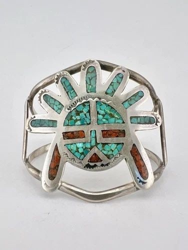 VTG NAVAJO STERLING SILVER TURQUOISE & CORAL CHIP INLAY SUNFACE CUFF BRACELET: Vtg Navajo Sterling Silver Turquoise & Coral Chip Inlay Sunface Cuff Bracelet Cuff is 5" tip to Tip and has a 1" Wide Adjustable Gap Cuff Is Just Under 2" Wide In the Center Weight is 26.1 Grams on my