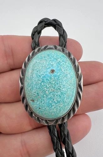 VINTAGE NAVAJO STERLING SILVER HIGH GRADE KINGMAN TURQUOISE STAMPED BOLO TIE: VINTAGE NAVAJO STERLING SILVER HIGH GRADE KINGMAN TURQUOISE STAMPED BOLO TIE Vintage Navajo Sterling Silver High Grade Kingman Turquoise Stamped Bolo Tie Size: 1 5/8" Tall by 1 1/4" Wide Weight is 44.