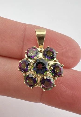 DESIGNER 10K YELLOW GOLD MYSTIC TOPAZ CLUSTER FLOWER PENDANT: DESIGNER 10K YELLOW GOLD MYSTIC TOPAZ CLUSTER FLOWER PENDANT Designer 10k Yellow Gold Mystic Topaz Cluster Flower Pendant Size: About 1" Tall With bail by 5/8" Wide Weight is 3.3 Grams on my scale Met