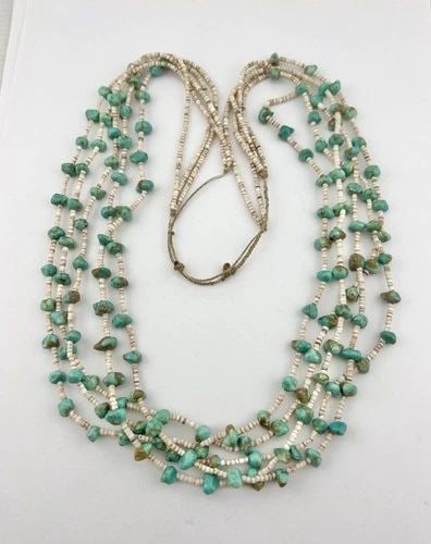 SANTO DOMINGO KEWA NEVADA TURQUOISE & OLIVE SHELL 5 STRAND HEISHI NECKLACE 28": Vtg Santo Domingo Kewa Nevada Turquoise & Olive Shell 5 Strand Heishi Necklace 28" The Turquoise Stones are From 7mm to 8mm Wide Necklace Is 5 Strands Total weight is 67.8 Grams on my scale Condition: