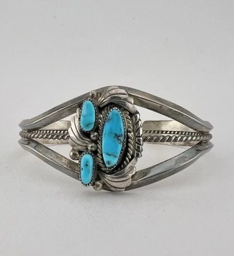 VTG NAVAJO STERLING SILVER SLEEPING BEAUTY TURQUOISE STAMPED TWIST CUFF BRACELET: VTG NAVAJO STERLING SILVER SLEEPING BEAUTY TURQUOISE STAMPED TWIST CUFF BRACELET Vtg Navajo Sterling Silver Sleeping Beauty Turquoise Stamped Twist Cuff Bracelet Cuff is 5 3/8" tip to Tip and has a 1"