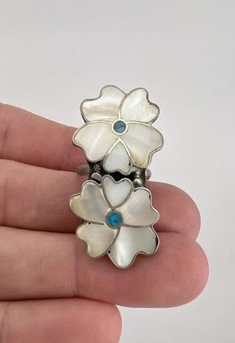 HUGE VTG ANSELM & ROSITA WALLACE ZUNI SILVER MOTHER OF PEARL DOUBLE FLOWER RING: HUGE Vtg Anselm & Rosita Wallace ZUNI Silver Mother of Pearl Double Flower Ring Ring Size: 5.25 - Can Be resized Weight is 7.0 Grams on my scale Metal: Sterling Silver Ring is 1 5/8" Tall In the Cente