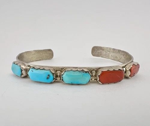 VTG A PENKETEWA ZUNI TURQUOISE & RED CORAL STERLING SILVER STAMPED CUFF BRACELET: VTG A PENKETEWA ZUNI TURQUOISE & RED CORAL STERLING SILVER STAMPED CUFF BRACELET Vtg A. Penketewa Zuni Turquoise & Red Coral Sterling Silver Stamped Cuff Bracelet Cuff is 5 1/8" tip to Tip and has a 1