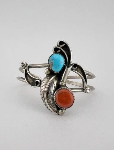 VINTAGE NAVAJO STERLING SILVER TURQUOISE & CORAL STAMPED BLOSSOM CUFF BRACELET: Vintage Navajo Sterling Silver Turquoise & Coral Stamped Blossom Cuff Bracelet Cuff is Around 4 3/4" tip to Tip and has a 1 3/8" Wide Adjustable Gap Cuff Is Just Under 1 3/4" Wide In the Center Weight