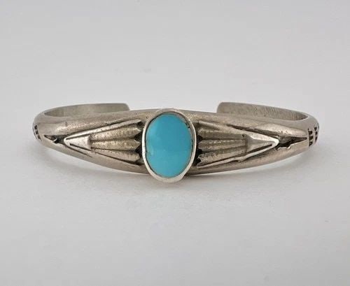 OLD PAWN NAVAJO INGOT SANDCAST STERLING SILVER TURQUOISE STAMPED CUFF BRACELET: OLD PAWN NAVAJO INGOT SANDCAST STERLING SILVER TURQUOISE STAMPED CUFF BRACELET Old Pawn Navajo Sandcast Sterling Silver Oval Turquoise Stamped Cuff Bracelet Cuff is 5 1/8" tip to Tip and has a 1" Wide