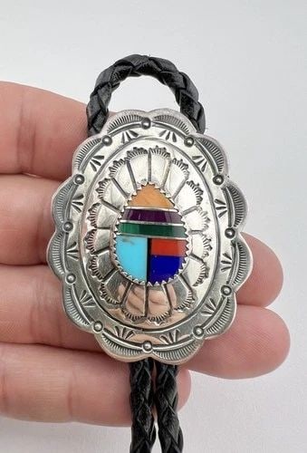 VINTAGE NAVAJO STERLING SILVER MULTI GEMSTONE STAMPED OVAL BOLO TIE 2": VINTAGE NAVAJO STERLING SILVER MULTI GEMSTONE STAMPED OVAL BOLO TIE 2" Vintage Navajo Sterling Silver Multi Gemstone Stamped Oval Bolo Tie 2" Bolo Size: 2" Tall & 1 5/8" Wide Weight is 27.0 Grams on m