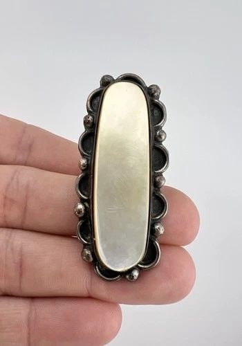 VINTAGE NAVAJO STERLING SILVER MOTHER OF PEARL STAMPED 2.25" LONG RING 20G: Vintage Navajo Sterling Silver Mother Of Pearl Stamped 2.25" Long Ring Ring Size: 5.75 - Can Be Re Sized Weight is 20.00 Grams on my scale Metal: Sterling Silver Ring is 2 1/4" Tall In the Center Amaz