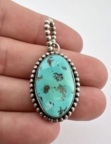VINTAGE PAUL LIVINGSTON NAVAJO SLEEPING BEAUTY TURQUOISE DANGLE PENDANT: VINTAGE PAUL LIVINGSTON NAVAJO SLEEPING BEAUTY TURQUOISE DANGLE PENDANT Vintage Paul Livingston Navajo Sleeping Beauty Turquoise Dangle Pendant Size: 1 7/8" Tall With bail by 7/8" Wide Weight is 11.9 