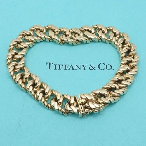 TIFFANY & CO. 14K YELLOW GOLD 10.5MM TWIST CUBAN LINK BRACELET - 8" 59.7 GRAM: TIFFANY & CO. 14K YELLOW GOLD 10.5MM TWIST CUBAN LINK BRACELET - 8" 59.7 GRAM Vintage Tiffany & Co. 14K Yellow Gold Twist Cuban Link Heavy Chain Bracelet with Box Clasp Length - 8" Long Fit up to Wris